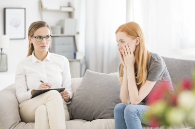 sad female patient with mental problems at psychological therapy session